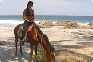 Horseback riding on the beach in Montezuma
